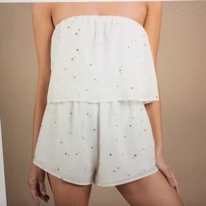 white romper with gold stars